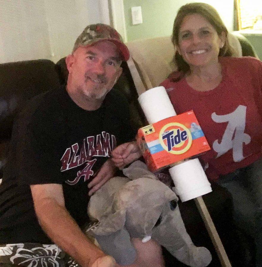 Joe and Cathy Lang get ready to cheer for the Alabama Crimson Tide. Roll, tide, roll, said Mr. Lang.