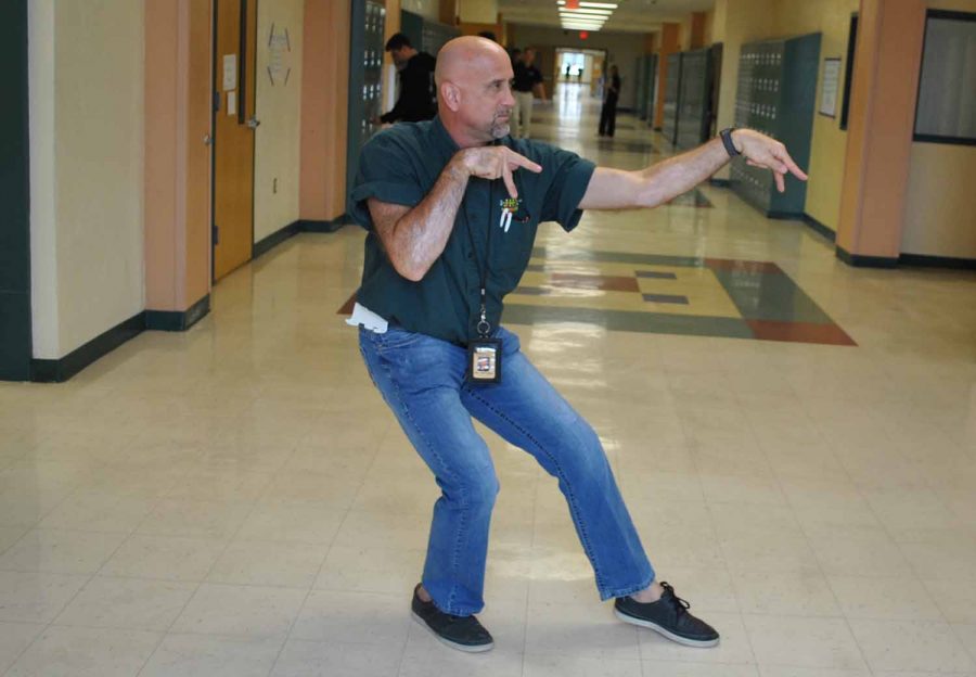Mr. Matousek shows off his Kung fu moves in the hallway outside his classroom.