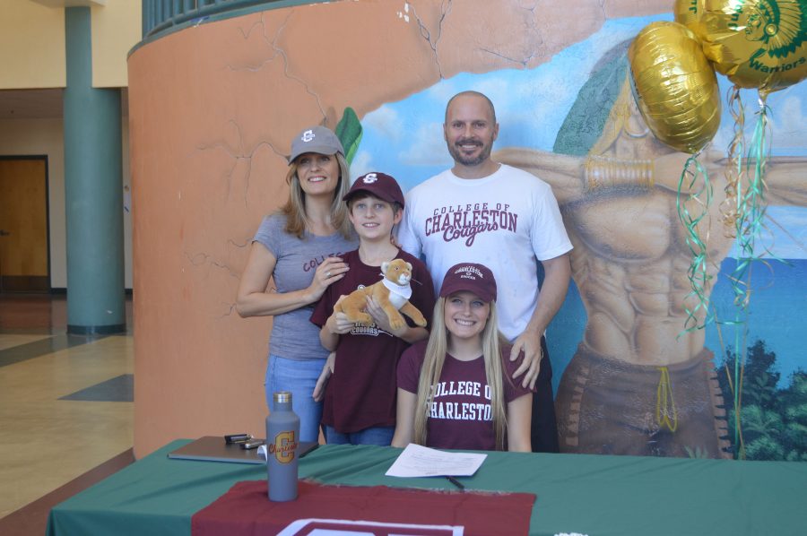 Mannetta and family on National Signing Day in the Jupiter High atrium.