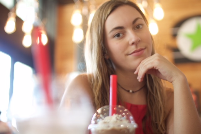 Katelyn+Smallwood+enjoys+a+milkshake+at+BurgerFi.+Photo+by+Lilly+Grella.