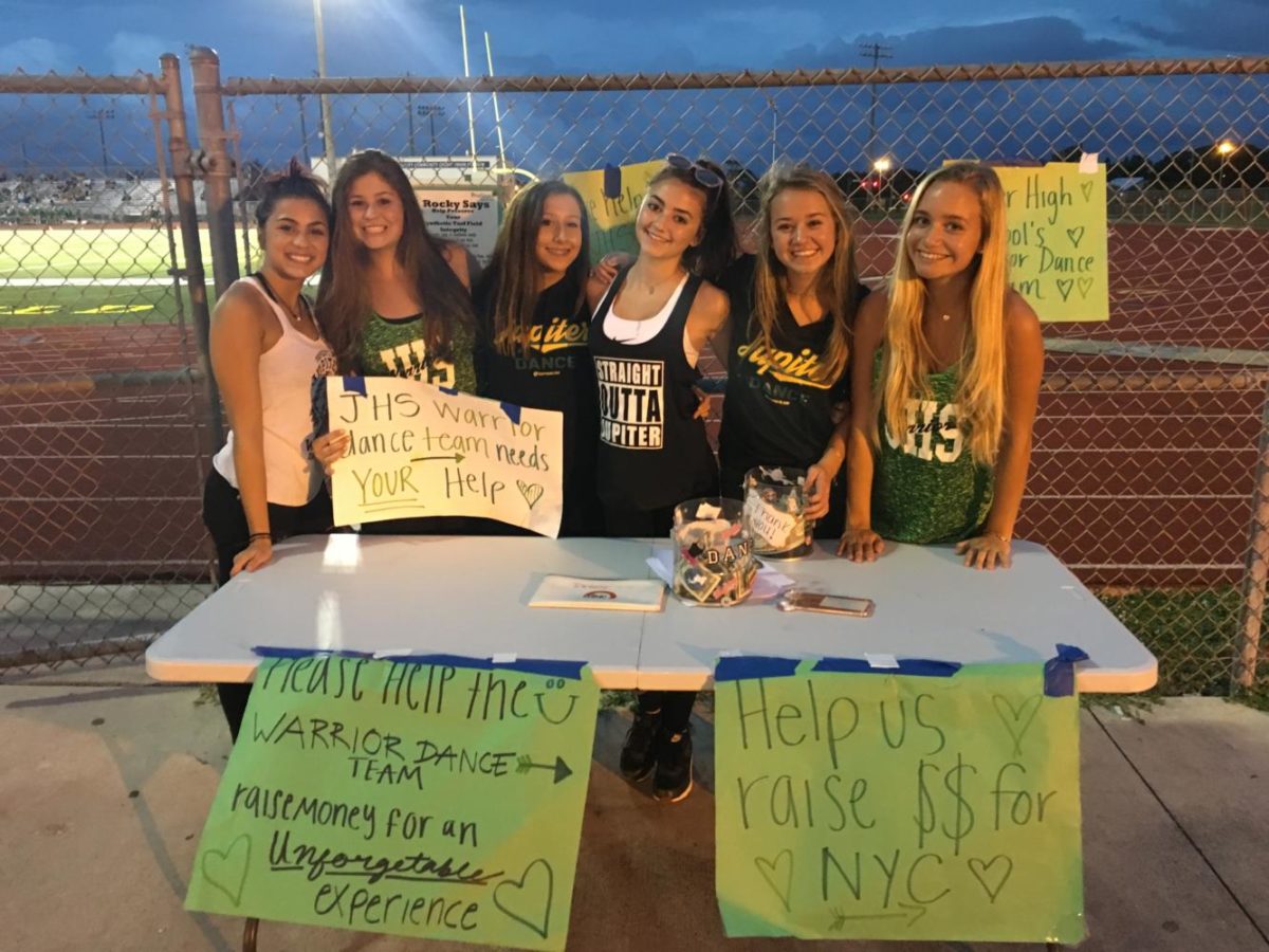 Dance team members help fundraise for their New York trip at a home football game September 1.