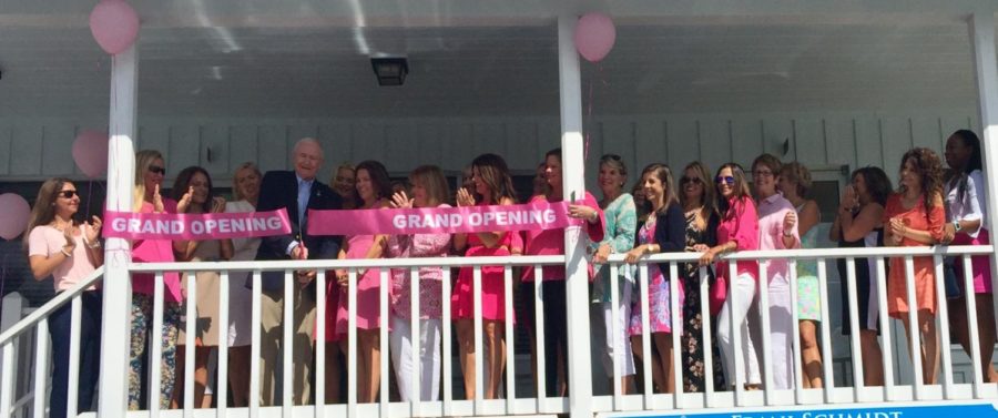 Major Darryl Aubrey cuts the grand opening ribbon for Renew the breast cancer boutique.

