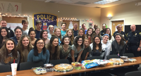 
SGA staff and Jupiter police group together after decorating the police station for the holidays.
Photo by. Jeanmarie McCann, the SGA teacher 

