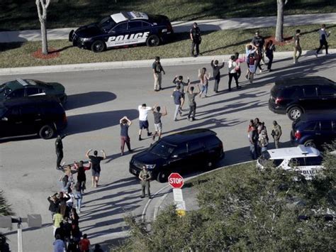 Students at Marjory Stoneman Douglas High School evacuate campus with help from local officials and law enforcements.