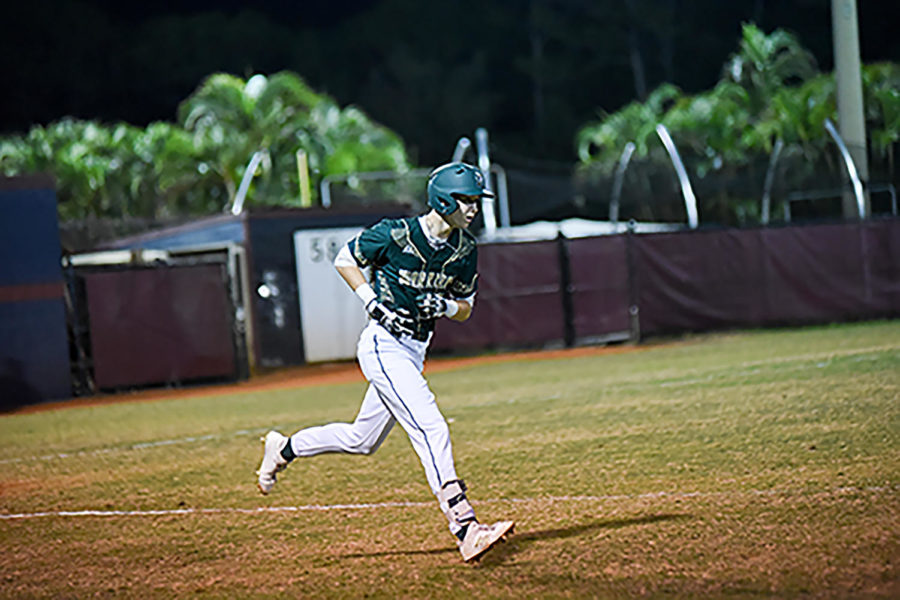 Feb 13, senior Ricky Clark rounds the bases in their game against rival Dwyer High School.