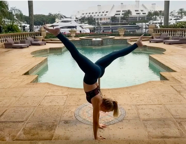 Kayleigh Sternberg, a Jupiter High senior, practices yoga by the water.