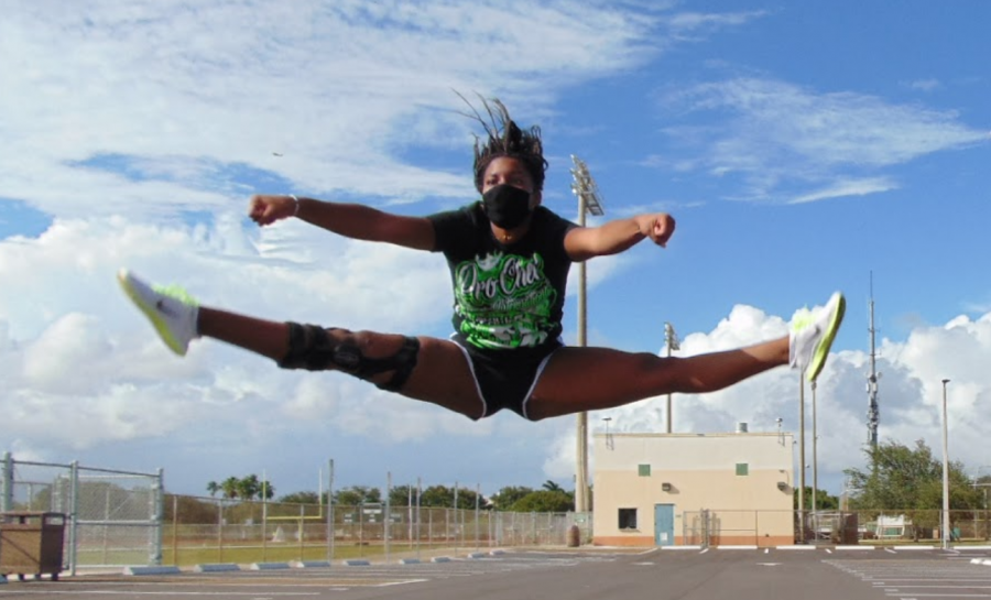 Jupiter High varsity cheerleader Bianca Stribling participates in  daily conditioning for the sideline cheer team.