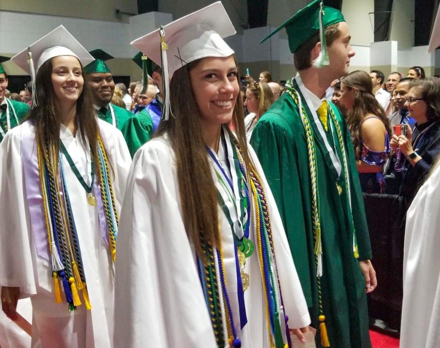 Alicia Gustafson walks with her fellow 2019 graduates at the Palm Beach County Convention Center.