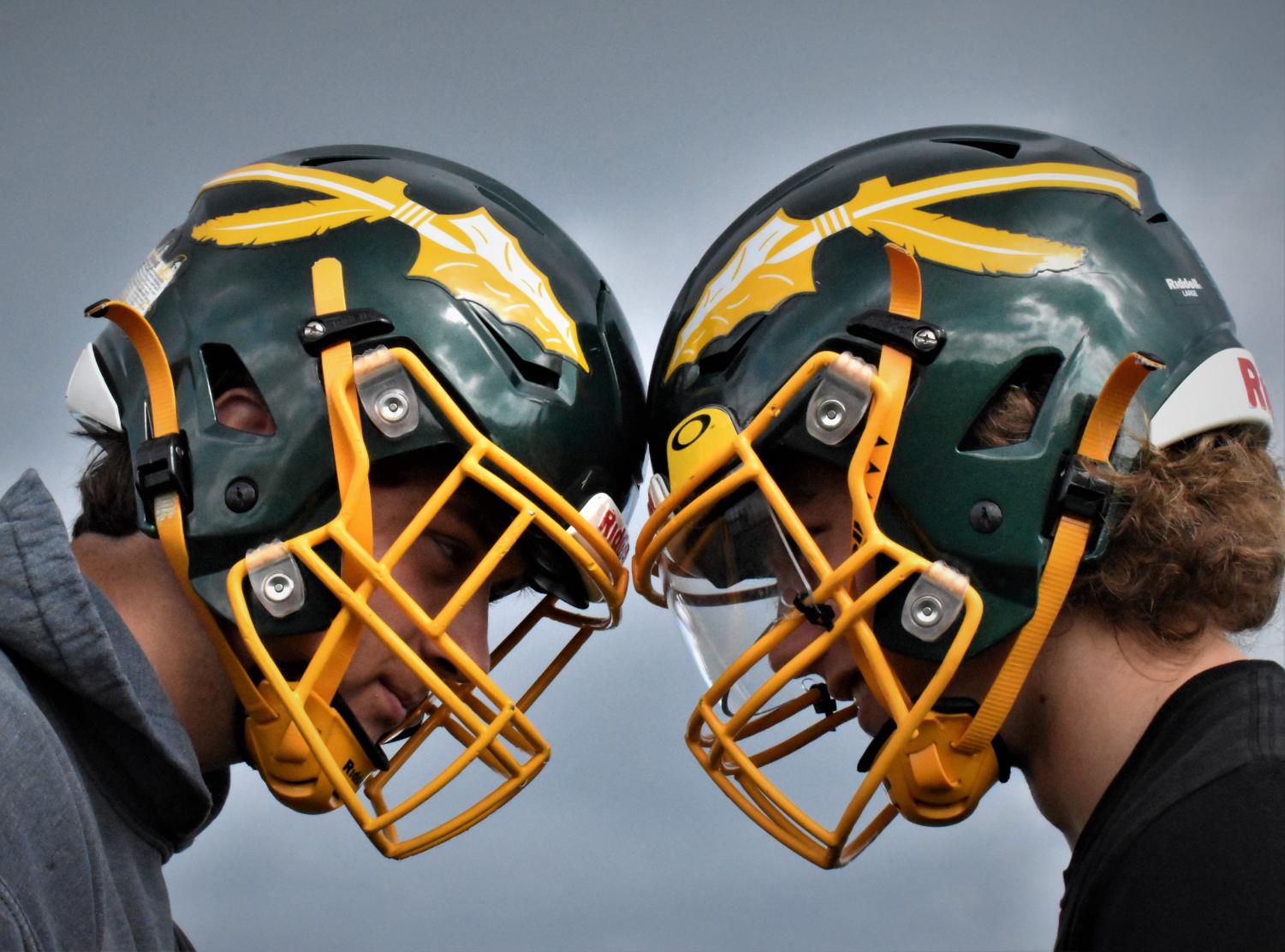 Two New Football Helmets Do Battle Against Concussions