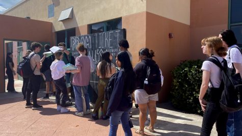 Students wait in line to purchase their prom tickets.