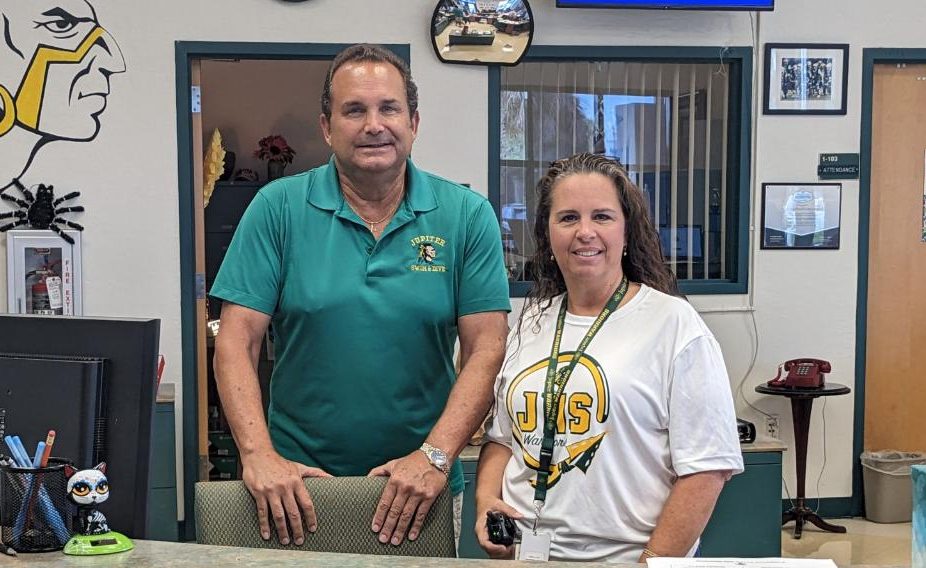 Gendron and Rute welcome visitors to Jupiter High with a smile. 