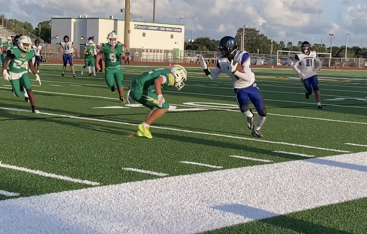 Jupiter defensive back makes tackle on Park Vista wide receiver.