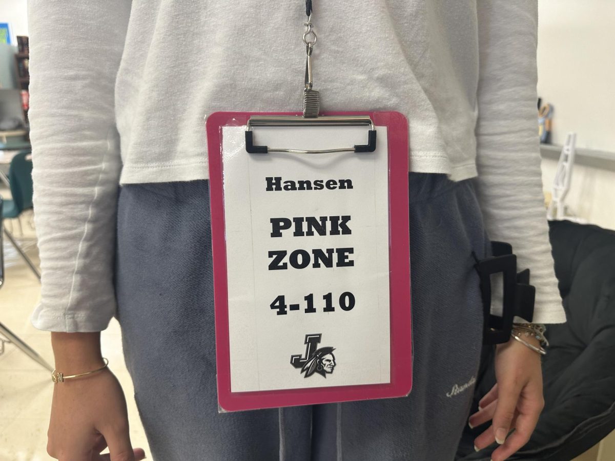 Student wearing color-coded bathroom pass