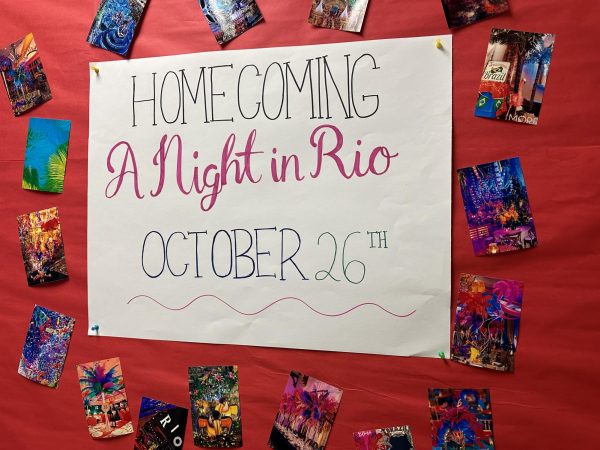 Poster for Homecoming hanging up in the SGA room