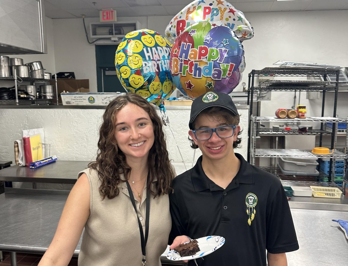 Juliana De Sena (left) with student, Dax (right) 