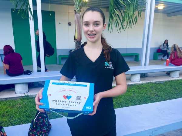 HOSA member Olivia Chandley with her fundraiser chocolate box.