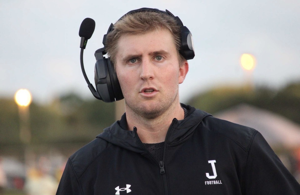 Joshua Brooks coaching the Jupiter High School football team.