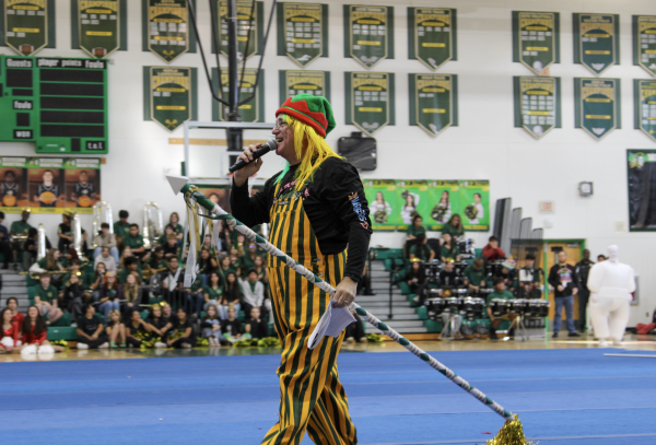Michael DeLeonardo announcing the dance team entrance at the winter pep rally at Jupiter High School. 
